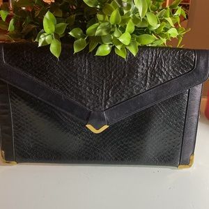 Koret Genuine black leather croc print clutch with gold hardware.